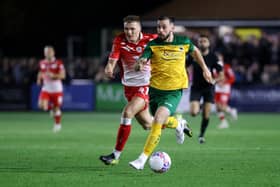 HORSHAM, ENGLAND - NOVEMBER 14: Lucas Santos Rodrigues of Horsham runs with the ball whilst under pressure from Jack Shepherd of Barnsley during the Emirates FA Cup First Round Replay match between Horsham and Barnsley at The Camping World Community Stadium on November 14, 2023 in Horsham, England. (Photo by Charlie Crowhurst/Getty Images)