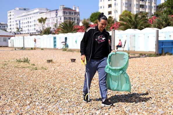 Ons Jabeur of Tunisia participating in a beach clean on Eastbourne seafront