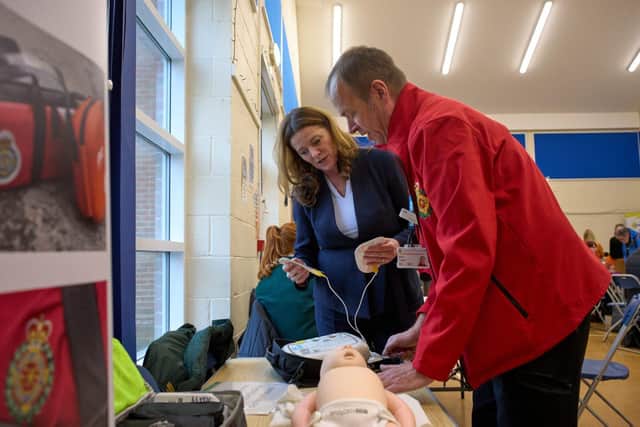 Gillian Keegan MP is given a CPR tutorial 