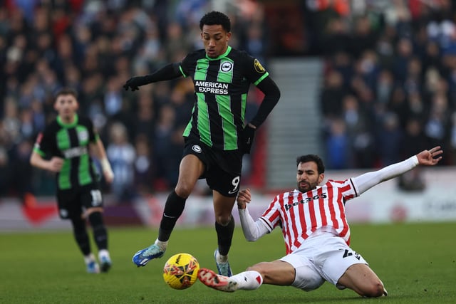 Stoke City's Algerian midfielder #27 Mehdi Leris (R) tackles Brighton's Brazilian striker #09 Joao Pedro (C) during the English FA Cup third round football match between Stoke City and Brighton and Hove Albion at the bet365 Stadium, in Stoke on Trent, central England, on January 6, 2024. (Photo by Darren Staples/AFP via Getty Images)