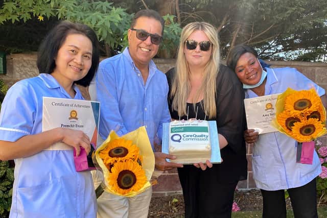 Prem Evans and Awa Jarjua receive long-service awards from Hollywynd Rest Home manager Jade Vaughan and director Dr Zahir Nasser