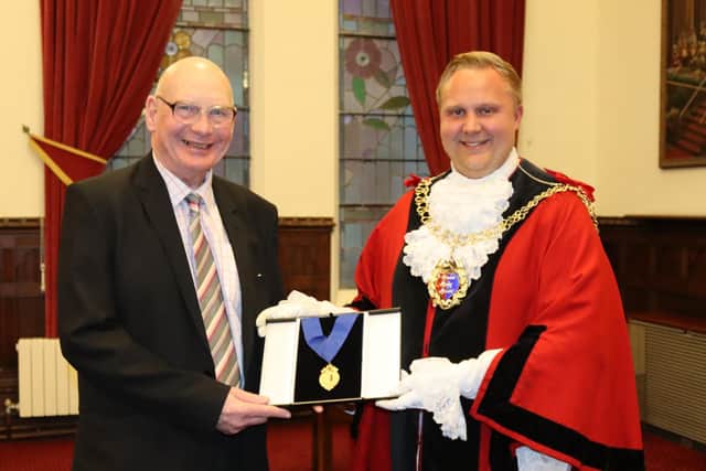 John Sands receives his award from the Mayor