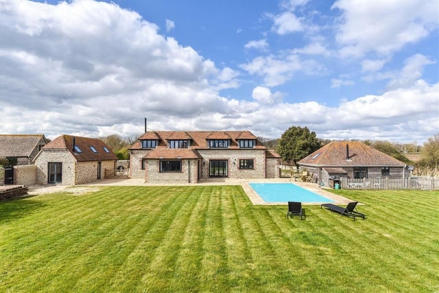 This £1,950,000 detached house is close to the beach and has four bedrooms, two receptions, a steam room and swimming pool and two Airbnb units.