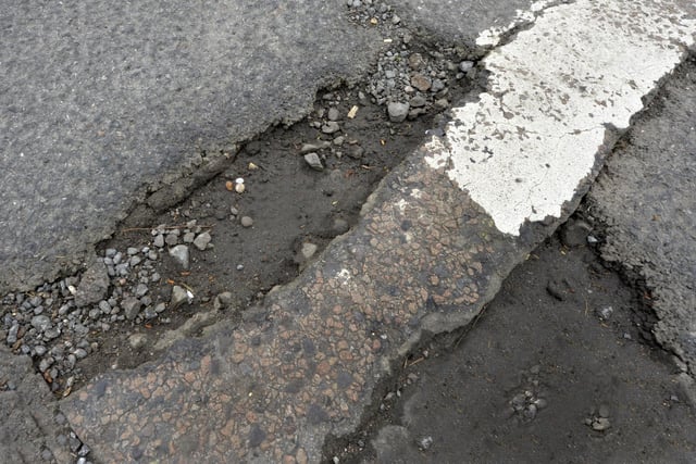 Potholes in Jevington Road, Polegate (Photo by Jon Rigby)