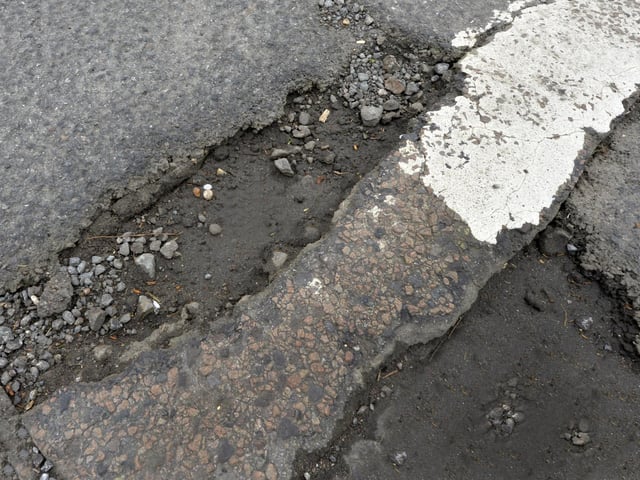 Potholes in Jevington Road, Polegate (Photo by Jon Rigby)
