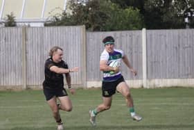 Bognor MoM Connor Herrington rounds his opposite number | Photo by Chloe Dent