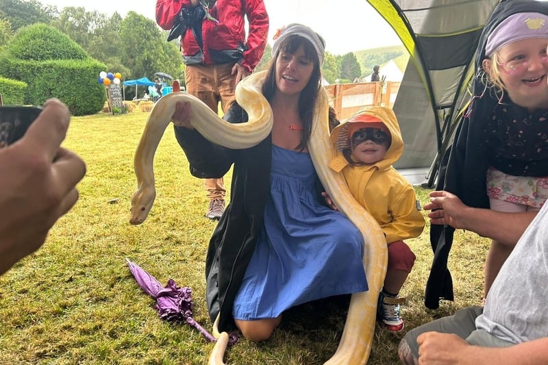 Hannah Peckham with son Bodhi and a large snake