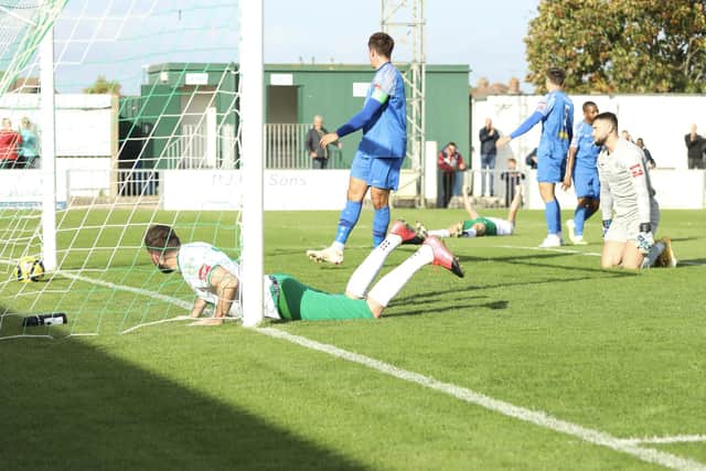 The ball is in the net for the Rocks - and so is scorer James Crane | Picture: Martin Denyer
