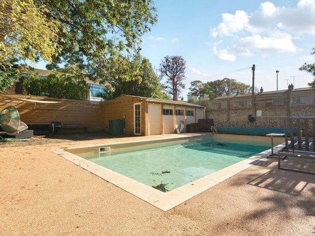There is a beautiful refurbished outdoor heated swimming pool at the end of the garden