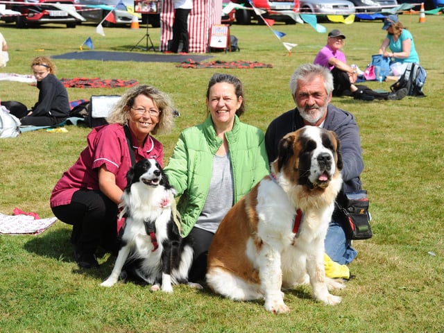 Pictured is: (left) Bev Henderson and Jason Henderson from Havant with their border collie Belle (2) and St Bernard Minka (4) and Debi Snowdon from Emsworth. Picture: Sarah Standing (260824-5565)