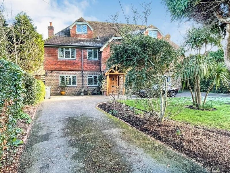 The property is approached via an 'in and out' driveway with plenty of parking space