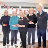 Joanne Dowzer (centre) presenting the winners of the Ladies competition with their prizes together with Andrew Ross, captain of Cottesmore Veterans.

