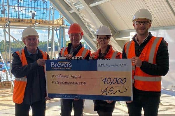 Crawley-based decorator centre donates £40,000 to St Catherine's Hospice