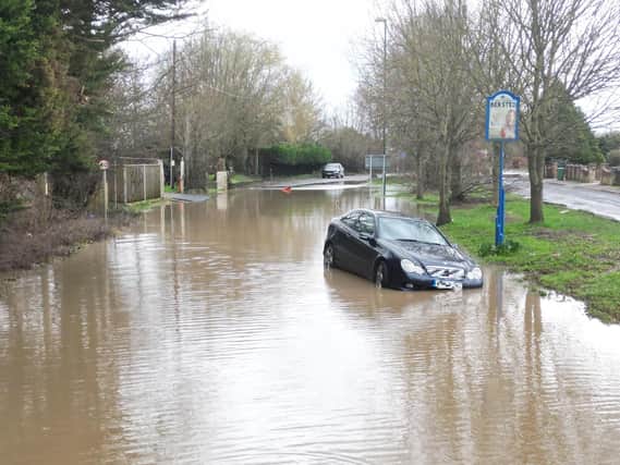 A car stuck in flood water on the A29 Shripney Road Road yesterday.
