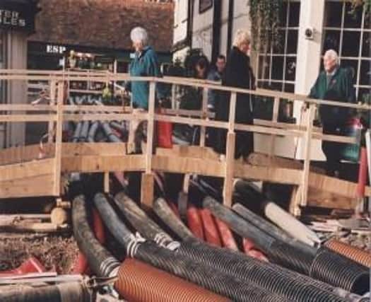 With heavy rain causing flooding and disruption across the South East, the Observer looks back on how Chichester saved itself from another potential disaster in the year 2000.