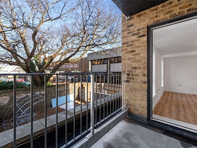 One two-bedroom apartment with balcony on the second floor is priced at £295,000. It has a light and spacious hallway and open-plan living / dining / kitchen area.