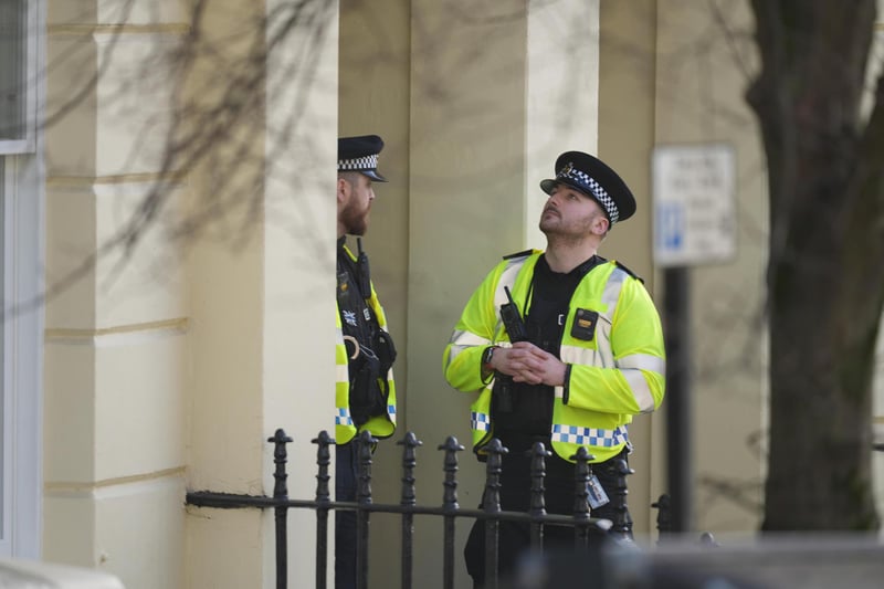 A large number of police officers have been seen outside a property in Hove following reports of an incident.