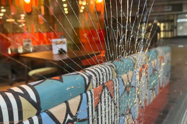 Before the new Nando's branch has even opened, it has become victim to vandalism – with the windows smashed in. Photo: Eddie Mitchell