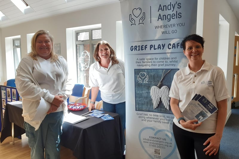 Andy's Angels founder Kayla Shepherd, right, and volunteers offering information on the charity's Grief Play Café for children and their families