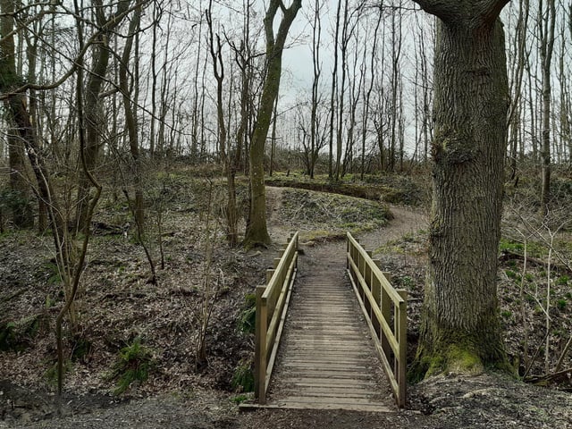 Cross the bridge and go up the windy path