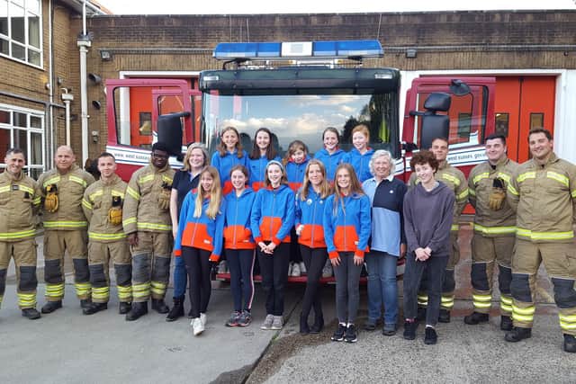 The 3rd Haywards Heath Guides with the crew from Mill Green Road fire station in Haywards Heath