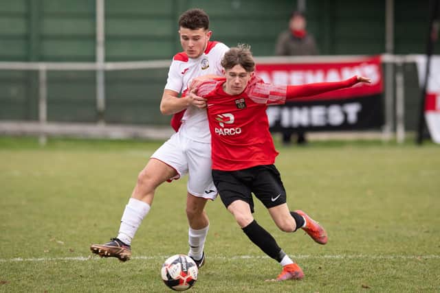 Horndean's Ben Anderson holds back Fareham's Connor Underhill. Picture: Keith Woodland