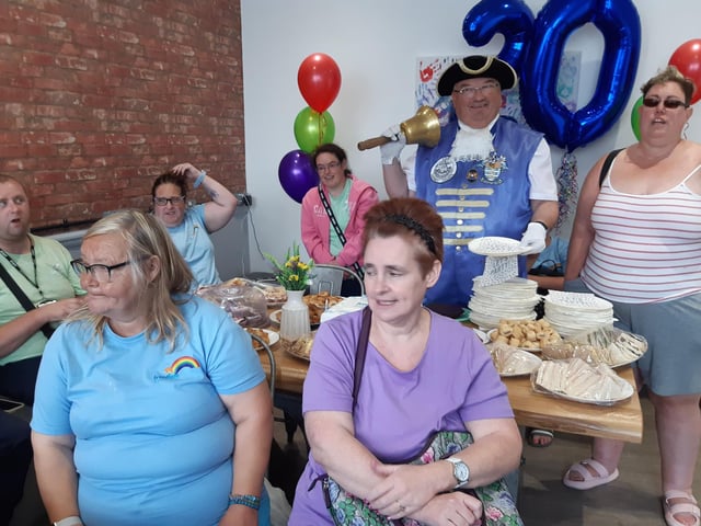 Frontline Associates Supported Tenancies celebrates the company's 20th anniversary and the first anniversary of the Frontline Hub, in Rowlands Road, Worthing, with a party for staff, service users and guests included Worthing town crier Bob Smytherman