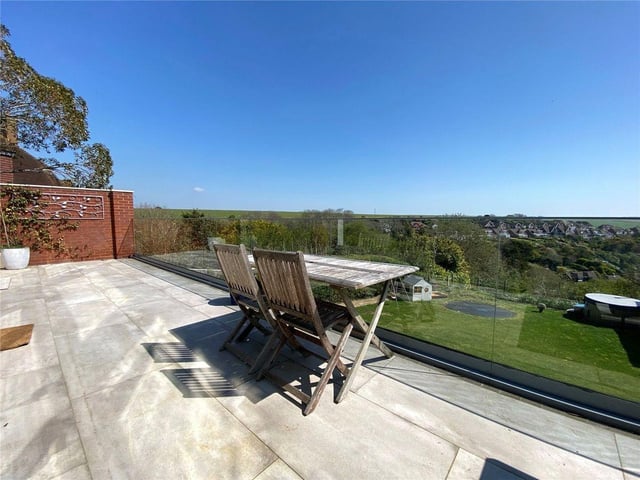 The property has a sliding glazed door to the terrace