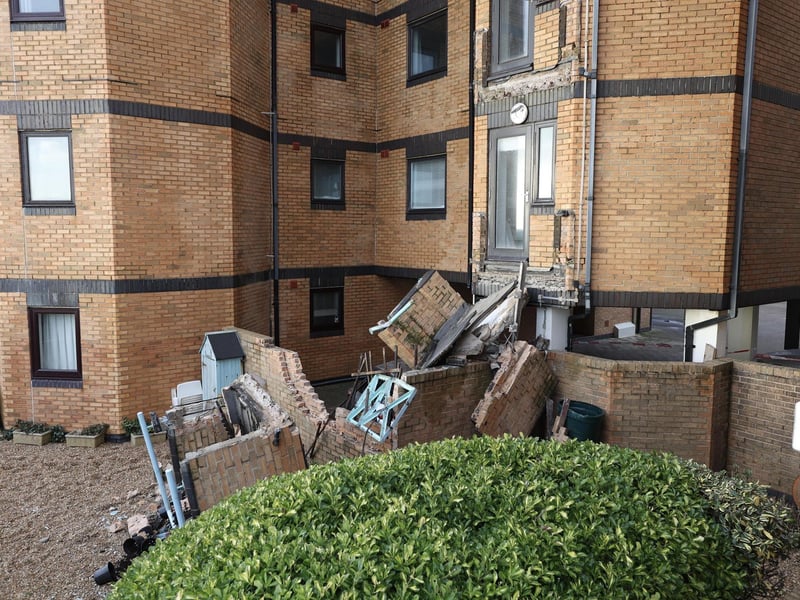 Residents in an East Sussex town have described their shock after two balconies collapsed at a residential block in the middle of Christmas celebrations.