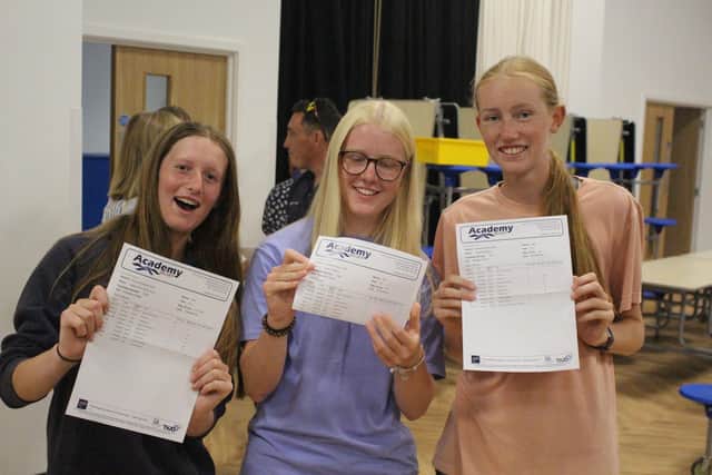 From left: Izzy Oliver, Sarah Walford and Holly Sharp celebrate after opening their results this year