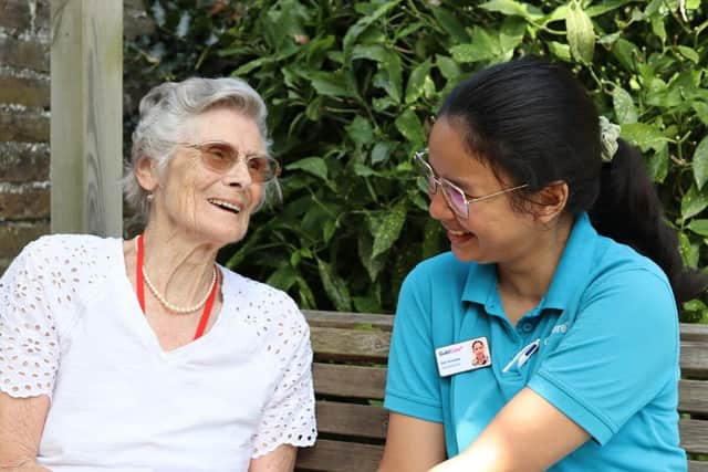 Brenda and a carer. Picture: Guild Care