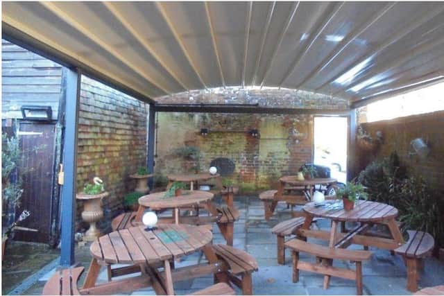 The garden pergola at the King's Arms pub in Horsham's Bishopric