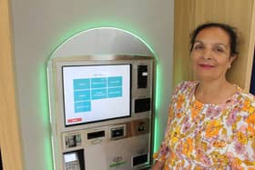 Cabinet Member for Resources Councillor Tahira Rana with one of the cash machines.