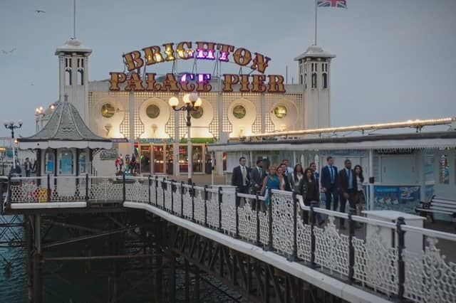 Mark, Sohail, Marnie, Victoria, Megan, Reece, Joe, Rochelle, Denisha, Dani, Avi, Bradley, Simba, Shazia, The candidates walk down Brighton Pier at the end of the task, Fremantlemedia Limited,N/A