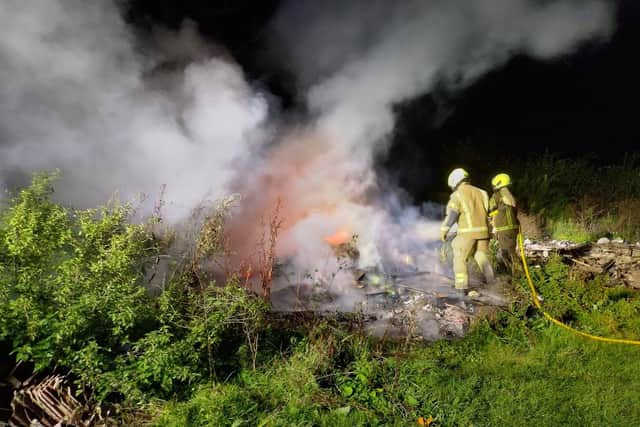 West Sussex Fire and Rescue staff attend a blaze off the A27