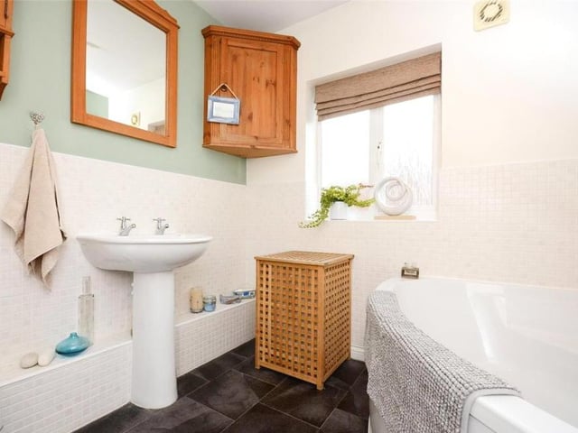 As well as the two en suites and the downstairs toilet, the Berry Hill Quarry property features this family bathroom on the first floor. Smart and stylish, it comprises a bath, wash hand basin, low-flush WC and storage space.