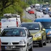 A 15 vehicle collision has closed the M23 in both directions as police have urged public to avoid the area.