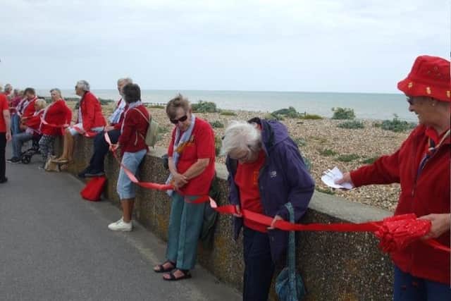 Sussex West county group formed a Sea of Red in Littlehampton as part of a region-wide celebration for Trefoil Guild's national 80th birthday
