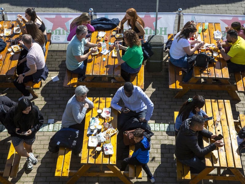 People enjoy the spring sunshine this Good Friday on Brighton beach in East Sussex.