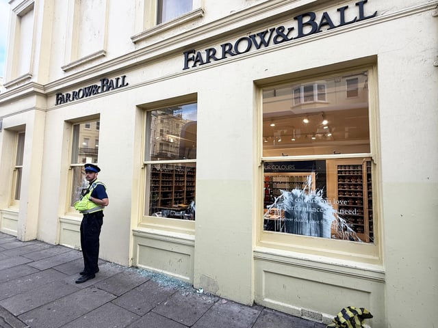 Police officers arrived in their numbers at the Farrow & Ball paint shop, in Western Road, on Wednesday afternoon (October 8).