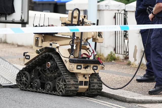 New photographs showed a bomb disposal vehicle back in Tarring Road on Thursday evening, with a police van and robot. Photo: Eddie Mitchell