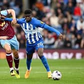 Carlos Baleba of Brighton & Hove Albion battles with Sander Berge of Burnley during the Premier League match at Turf Moor