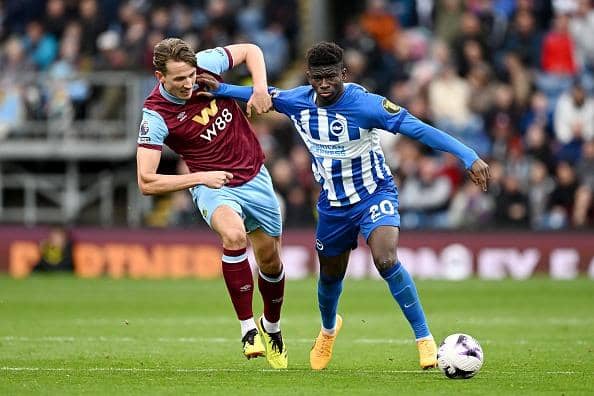 Carlos Baleba of Brighton & Hove Albion battles with Sander Berge of Burnley during the Premier League match at Turf Moor