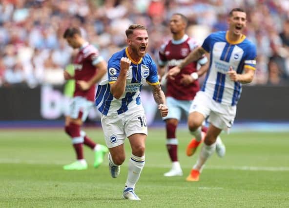 Brighton and Hove Albion midfielder Alexis Mac Allister celebrates his first half penalty against West Ham in the Premier League