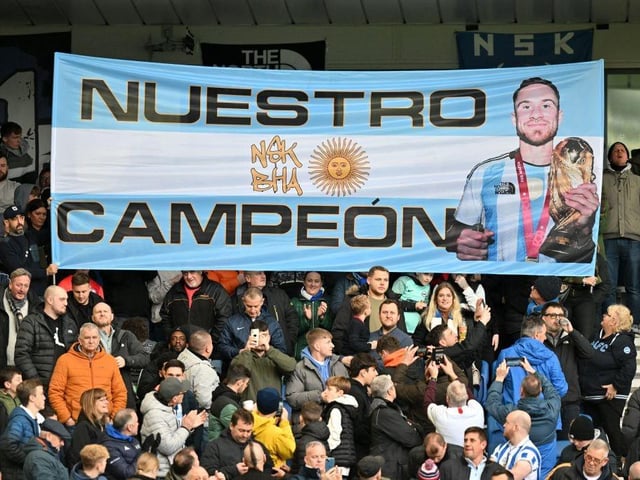Brighton fans display a large banner in honour of Brighton's Argentinian midfielder Alexis Mac Allister ahead of the English Premier League football match between Brighton and Hove Albion and Liverpool at the American Express Community Stadium in Brighton, southern England on January 14, 2023. . (Photo by GLYN KIRK/AFP via Getty Images)