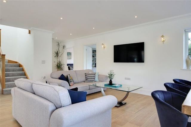 Large sliding doors take you through into a very spacious open plan kitchen/living and dining area.