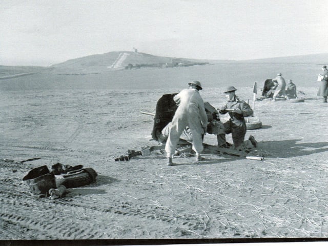 Troops of Westminster Regiment firing 2-pounder guns on the Shooter’s Bottom Range, Beachy Head.