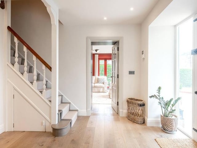 Entry to the house is through a pillared portico into a hallway