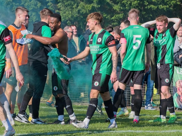 Burgess Hill Town players, fans and staff celebrate surviving in the Isthmian south east division at the end of their 0-0 draw with Beckenham
