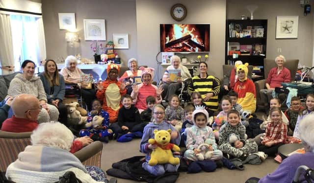 Residents at Amherst House read bedtime stories to local children